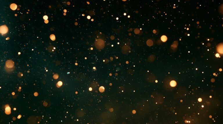 Small amber lights, some sharp and some diffuse, in a dark field