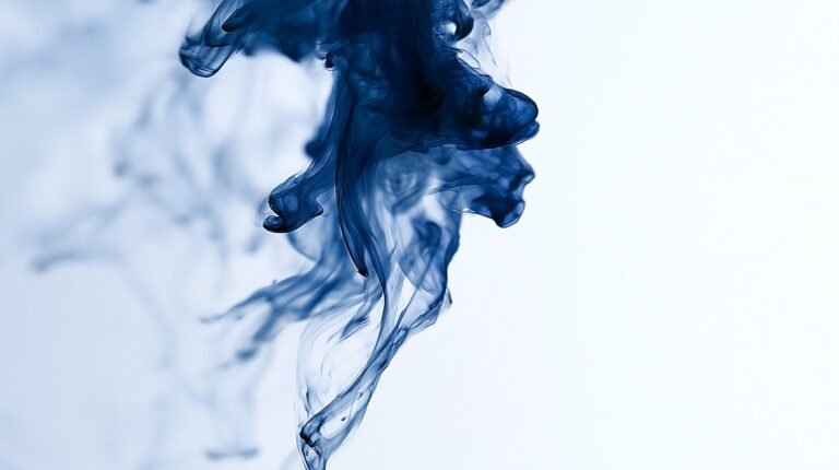 Interwoven indigo tendrils descending through clear water