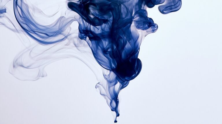 Ink dispersing gradually into deep still water
