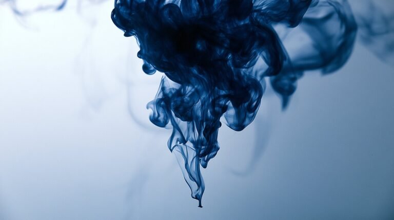 A dense blue column thinning into fine threads